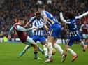 Josh Brownhill of Burnley scores their side's second goal during the Premier League match between Brighton & Hove Albion and Burnley at American Express Community Stadium on February 19, 2022 in Brighton, England.