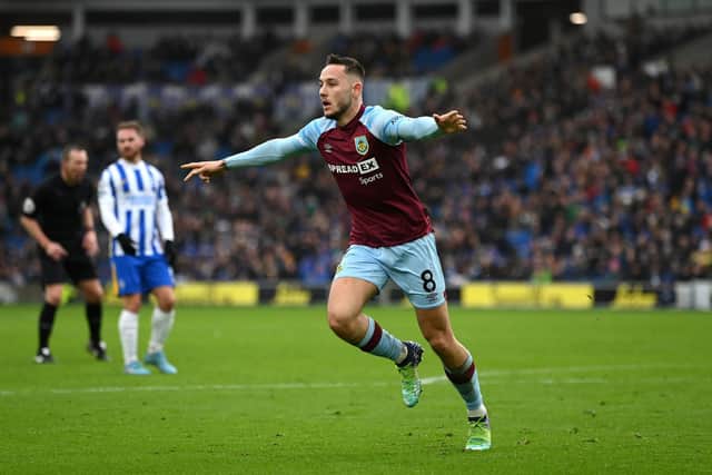 Josh Brownhill of Burnley celebrates after scoring their side's second goal during the Premier League match between Brighton & Hove Albion and Burnley at American Express Community Stadium on February 19, 2022 in Brighton, England.