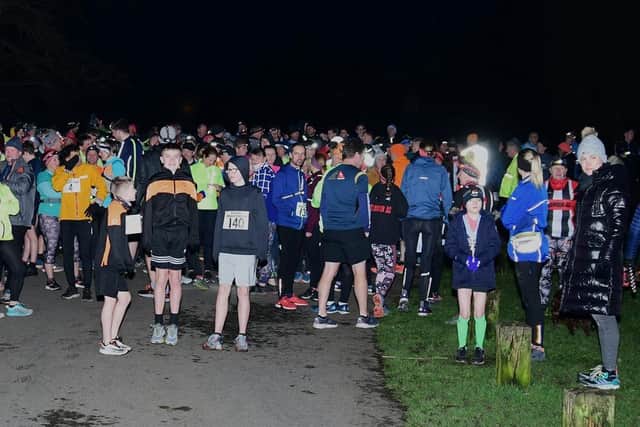 Runners gather for the torchlight run to support Jez Bradshaw and his family (photo by David Belshaw)