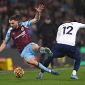 Burnley striker Jay Rodriguez is fouled by Emerson Royal during the Premier League match between Burnley and Tottenham Hotspur at Turf Moor on February 23, 2022 in Burnley, England.
