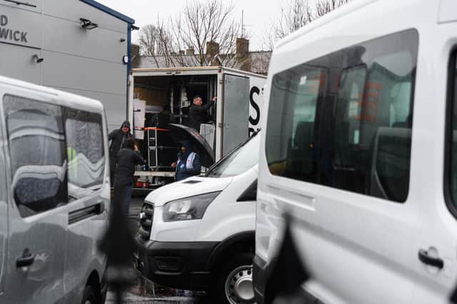 Filming crews setting up at Dave Fishwick Minibuses in Colne ahead of shooting new Netflix movie 'The Bank of Dave'