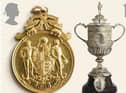 A replica of the first trophy, known as the ‘little tin idol’, which was used from 1896-1910 after the original Cup was stolen. A new trophy (the design still used today) was introduced in 1911.
Pictured beside it, the FA Cup winners’ medal awarded to Bradford City captain Jimmy Speirs in 1911. Speirs scored the only goal in the replay against Newcastle United, which secured a win for the ‘Bantams’.
