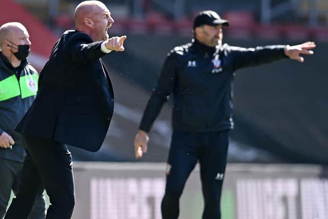 Burnley's English manager Sean Dyche (L) and Southampton's Austrian manager Ralph Hasenhuttl (R) gesture from the sidelines during the English Premier League football match at St Mary's Stadium in Southampton, southern England on April 4, 2021.