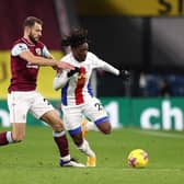 Eberechi Eze of Crystal Palace is challenged by Erik Pieters of Burnley during the Premier League match between Burnley and Crystal Palace at Turf Moor on November 23, 2020 in Burnley, England.