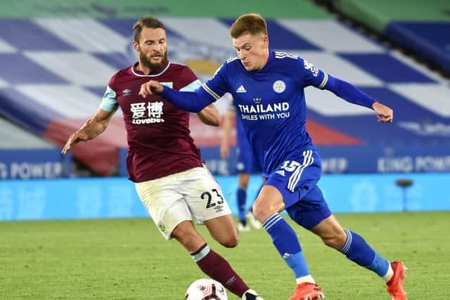 Harvey Barnes of Leicester City battles for possession with Erik Pieters of Burnley during the Premier League match between Leicester City and Burnley at The King Power Stadium on September 20, 2020 in Leicester, England.