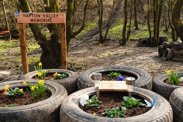 OId tyres dumped at the site have  been recycled to create mine cart style flowerbeds