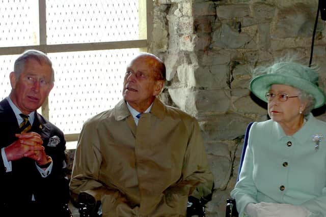 Prince Philip on a visit to Burnley in 2012 with Prince Charles and Her Majesty the Queen