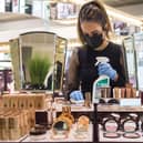 A John Lewis works cleans the Charlotte Tilbury counter at a Peter Jones store as they prepare for reopening on Monday. Picture: Kirsty O'Connor/Press Association