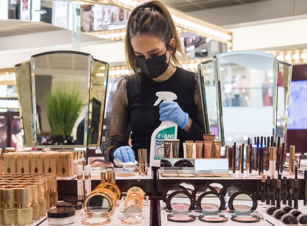 A John Lewis works cleans the Charlotte Tilbury counter at a Peter Jones store as they prepare for reopening on Monday. Picture: Kirsty O'Connor/Press Association