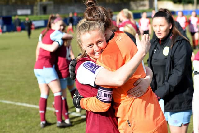 Lauren Bracewell, right, celebrates after her three penalty saves on Sunday