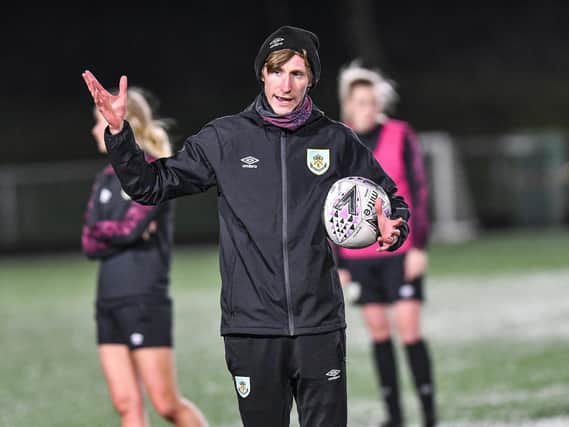 Burnley FC Women's boss Matt Bee instructs his players during a training session at The Barnfield Training Centre.