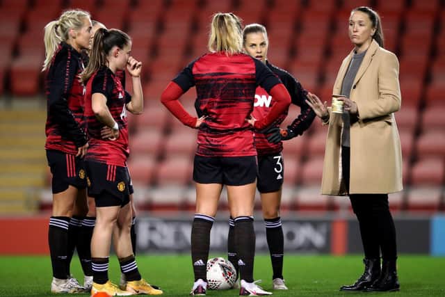 Manchester United Head Coach, Casey Stoney talks to her players ahead of the FA Women's Continental League Cup match between Manchester United and Manchester City at Leigh Sports Village on November 19, 2020 in Leigh, England.