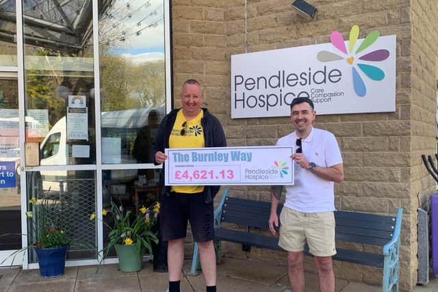 Daniel (left) and Kevin present a cheque to Pendleside Hospice for the cash they raised in honour of their grandma