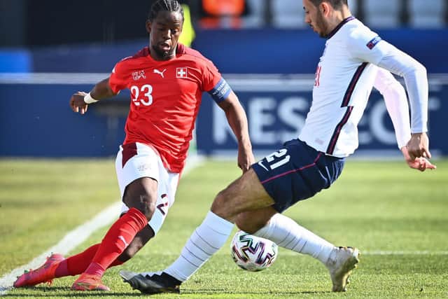Jordan Lotomba of Switzerland (L) and Dwight McNeil of England fight for the ball during the 2021 UEFA European Under-21 Championship Group D football match between England and Switzerland at Bonifika Stadium in Koper, on March 25, 2021.