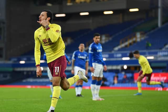 Dwight McNeil of Burnley celebrates after scoring their team's second goal during the Premier League match between Everton and Burnley at Goodison Park on March 13, 2021 in Liverpool, England.