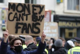 Supporters protest outside Chelsea's ground before the announcement of the wholesale English withdrawal from the European Super League