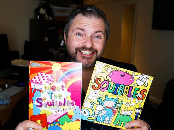 Jay Stansfield with his Squibbles' books. Photo: Maisy Turner-Stansfield