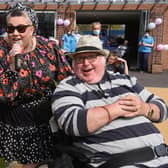 Singer Dani Wallace and her dad Danny Gallagher, a Sue Ryder centre resident, were reunited at the birthday party                  Photo: Neil Cross
