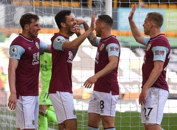 Burnley's New Zealand striker Chris Wood (L) celebrates with Dwight McNeil (2L), Josh Brownhill (2R) and Matej Vydra (R) during the English Premier League football match between Wolverhampton Wanderers and Burnley at the Molineux stadium in Wolverhampton.