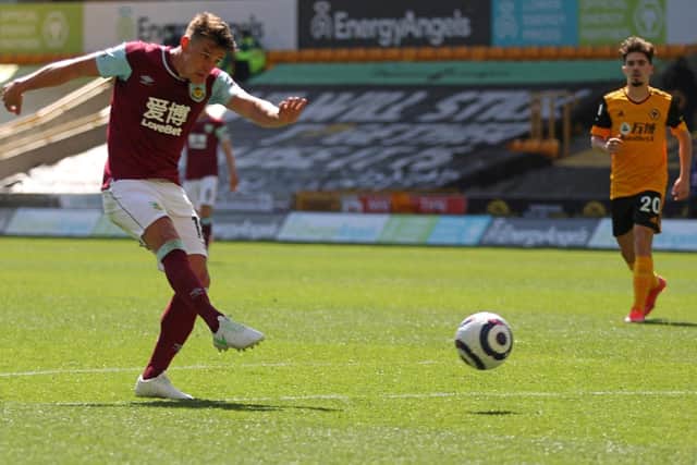 Burnley's English midfielder Ashley Westwood scores his team's fourth goal during the English Premier League football match between Wolverhampton Wanderers and Burnley at the Molineux stadium in Wolverhampton, central England on April 25, 2021.