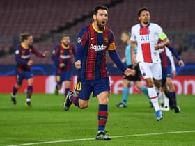 Lionel Messi of FC Barcelona celebrates after scoring their side's first goal during the UEFA Champions League Round of 16 match between FC Barcelona and Paris Saint-Germain at Camp Nou on February 16, 2021 in Barcelona, Spain.