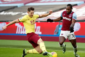 West Ham United's English midfielder Michail Antonio (R) vies with Burnley's English defender James Tarkowski during the English Premier League football match between West Ham United and Burnley at The London Stadium, in east London on January 16, 2021.