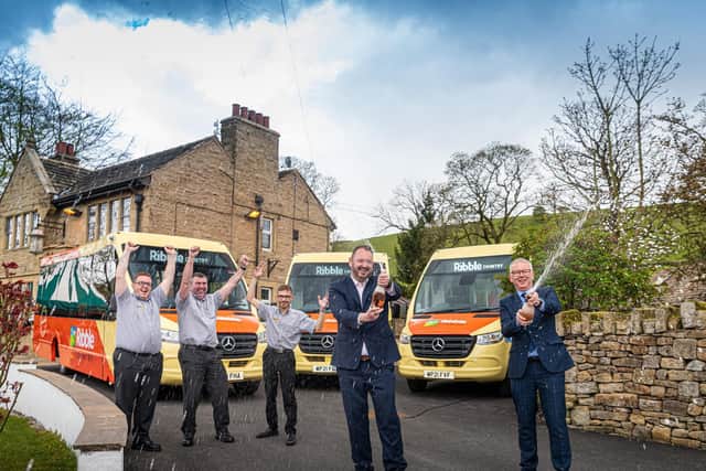 Celebrating the launch of the new bus network serving the Ribble Valley are, from left, drivers Chris Corey, Steve Beharrell and Curtis Payne; Transdev CEO Alex Hornby; and Lancashire County Council public transport manager Andrew Varley.