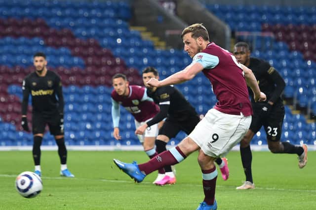 Chris Wood of Burnley scores their side's first goal from the penalty spot during the Premier League match between Burnley and West Ham United at Turf Moor on May 03, 2021 in Burnley, England.