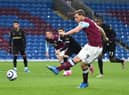 Chris Wood of Burnley scores their side's first goal from the penalty spot during the Premier League match between Burnley and West Ham United at Turf Moor on May 03, 2021 in Burnley, England.