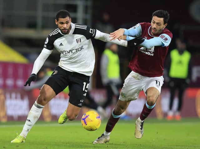 Fulham's English midfielder Ruben Loftus-Cheek (L) vies with Burnley's English midfielder Dwight McNeil during the English Premier League football match between Burnley and Fulham at Turf Moor in Burnley, north west England on February 17, 2021.