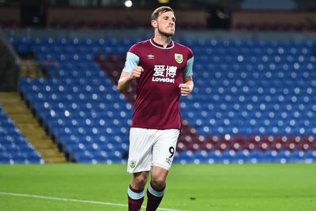 Chris Wood of Burnley celebrates after scoring their side's first goal during the Premier League match between Burnley and West Ham United at Turf Moor on May 03, 2021 in Burnley, England.