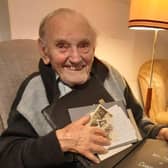 Mr Hyslop pictured two years ago with his scrapbook from his days in the RAF