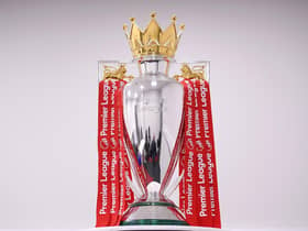 The Premier League Trophy is dressed in Liverpool Red Ribbons ready for the presentation ceremony ahead of the Premier League match between Liverpool FC and Chelsea FC at Anfield on July 22, 2020 in Liverpool, England.