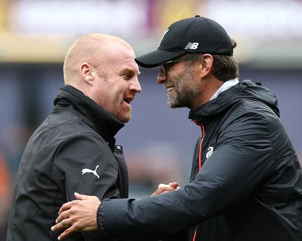 Manager of Liverpool Jurgen Klopp and Sean Dyche, Manager of Burnley embrace ahead of kick off during the Premier League match between Burnley and Liverpool at Turf Moor on August 20, 2016 in Burnley, England.