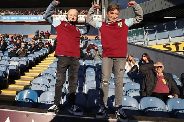 Fans react during the English Premier League football match between Burnley and Liverpool at Turf Moor in Burnley, north west England on May 19, 2021.