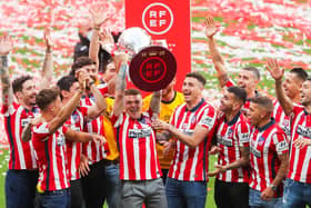 Kieran Trippier raises the La Liga trophy aloft