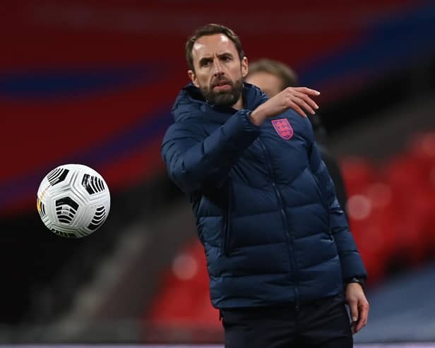 England's manager Gareth Southgate tosses the ball during the UEFA Nations League group A2 football match between England and Denmark at Wembley stadium in north London on October 14, 2020.