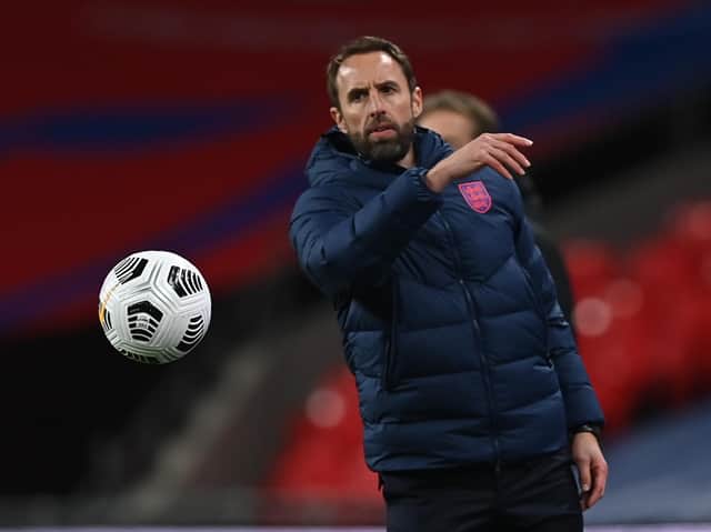 England's manager Gareth Southgate tosses the ball during the UEFA Nations League group A2 football match between England and Denmark at Wembley stadium in north London on October 14, 2020.