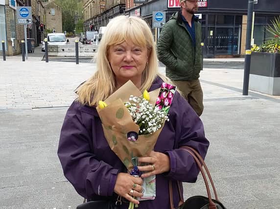 Flowers were handed out to shoppers in Burnley town centre as a 'thank you' for their support