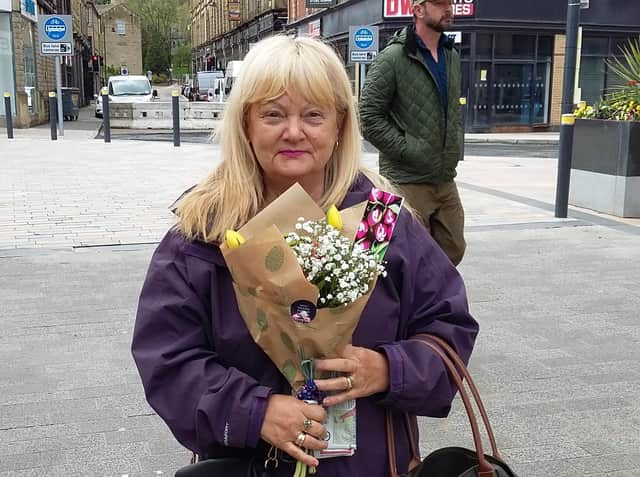 Flowers were handed out to shoppers in Burnley town centre as a 'thank you' for their support