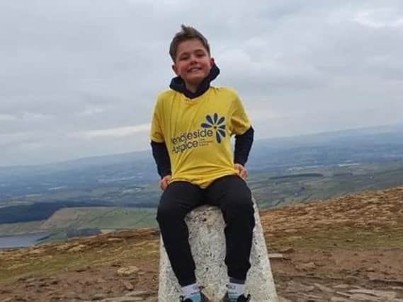 Nine-year-old Riley on one of his many trips to the Pendle Hill trig point
