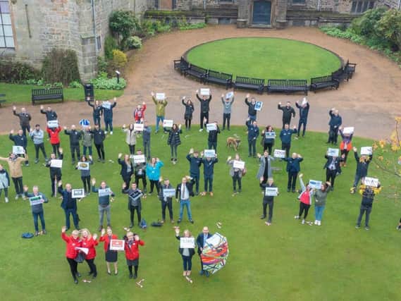 Representatives of 35 businesses taking part in the MEGA Raisathon are pictured by drone outside Towneley Hall