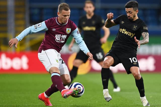 Matej Vydra of Burnley battles for possession with Manuel Lanzini of West Ham United during the Premier League match between Burnley and West Ham United at Turf Moor on May 03, 2021 in Burnley, England.