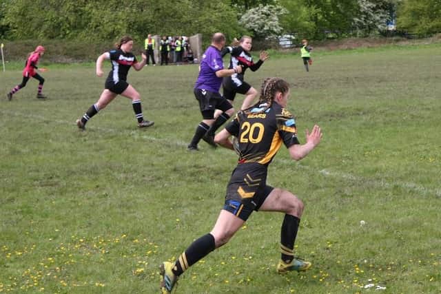 Teenage rugby ace Amelia Burton gets away from her marker and drives Ashton Bears up the pitch.