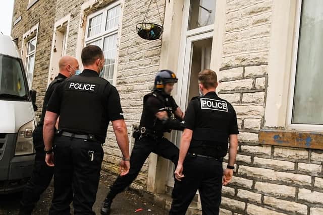 Police executed warrants at three addresses in Burnley today. Photo: Kelvin Stuttard