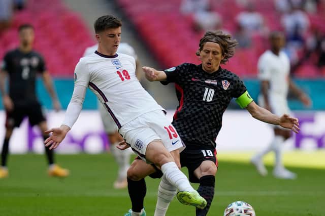 England's midfielder Mason Mount(L) plays the ball with Croatia's midfielder Luka Modric during the UEFA EURO 2020 Group D football match between England and Croatia at Wembley Stadium in London on June 13, 2021.