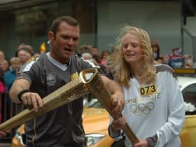 Elizabeth Greenwood has the torch lit before her route starts.