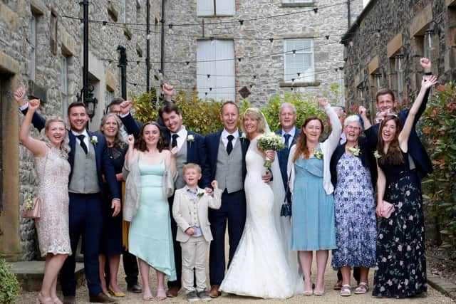 The happy couple with family. Photo credit: Zoie Carter Ingham Photography