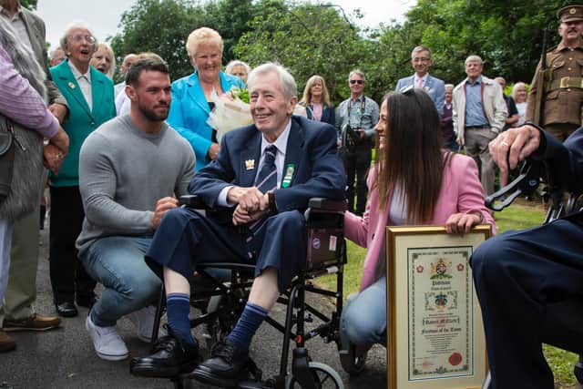 Bob Clark after receiving the Freedom of the Town, surrounded by well wishers including his granddaughter Sophie and wife Ann (photo by Naz Alam)