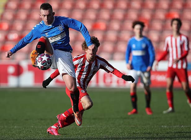 Ciaran Dickson of Rangers vies with Mario Soriano of Athletico Madrid during the UEFA Youth League match between Rangers U19 and Atletico Madrid U19 at Firhill Park on February 12, 2020 in Glasgow, United Kingdom.